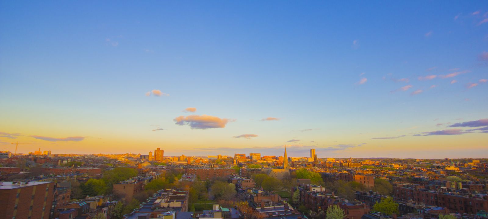 Rooftop Bar view of city dusk in Boston, Massachusetts, from The Colonnade Hotel