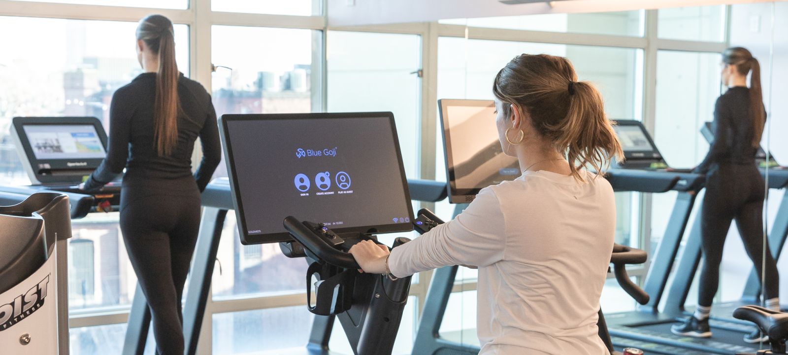 A Woman Working Out On A Treadmill In A Gym