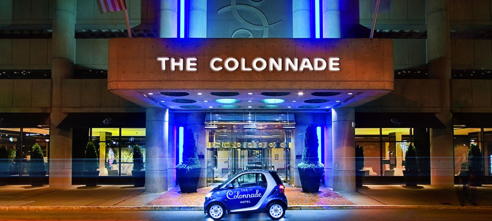The Colonnade Hotel Entrance with smart car in front at night